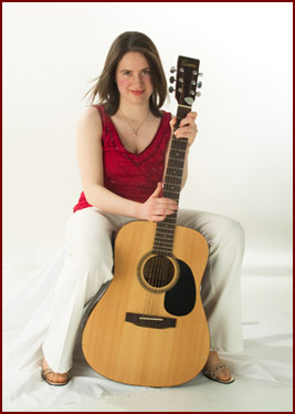Aine Woods with her guitar.